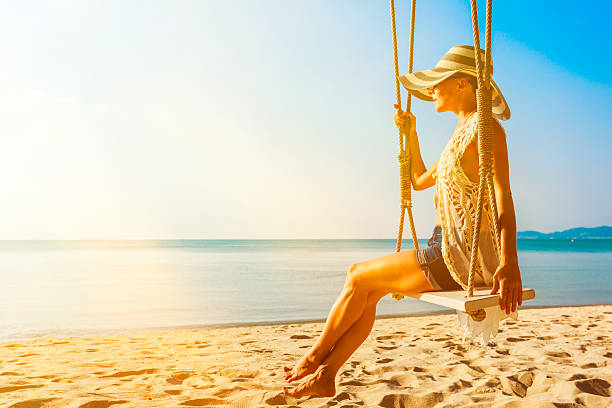 istock Woman at tropical swing 610435320