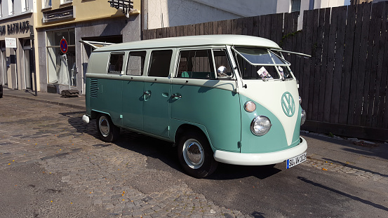 Cologne, Germany - September 23, 2016: The famous VW bus called Bulli in the streets of Cologne Germany. This bus is an advertising mobile for a small firm. The Volkswagen Bus T1 was build in the years 1950 - 1967. 