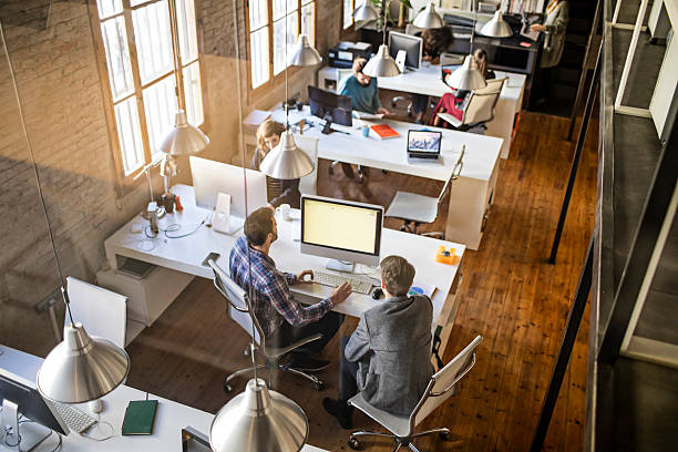 Startup office Young business people working on a startup office. small office interior stock pictures, royalty-free photos & images