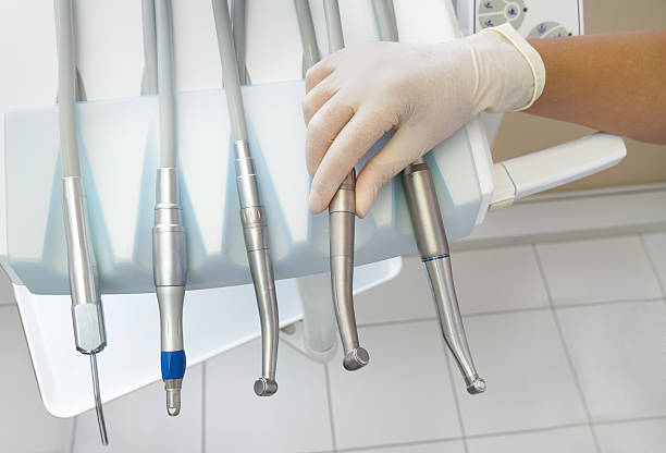 istock Dentist holding a dental instrument 610438872