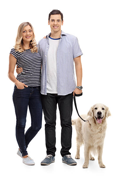 istock Young couple posing with their dog 610439882