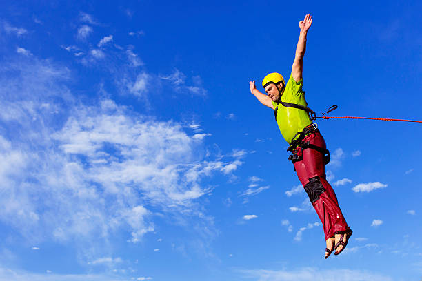 DEN HAAG, SCHEVENINGEN PIER, Netherlands - JUNE 09, 2013: Bungee jumping at the tower of a pier. Tourists attraction. Bungy Jump Center - one and only Bungy Jump Center in the Netherlands