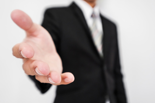 Businessman reaching hand at front, selective focus, shallow depth of field