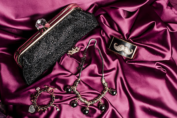 istock set of women's accessories on a silk background 610441228