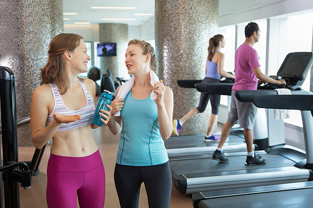 istock Two Young Women Talking after Training in Gym 610442370