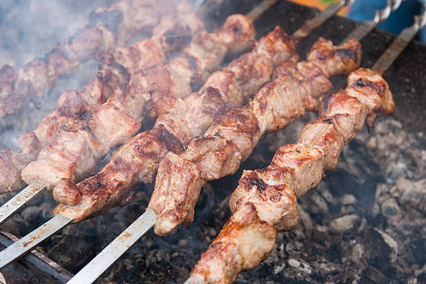 istock Meat skewers on a charcoal grill 610442394