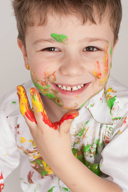 istock portrait of a boy on a light background 610442544