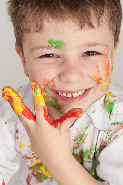 istock portrait of a boy on a light background 610443420