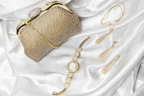 istock set of women's accessories on a white silk background 610445300