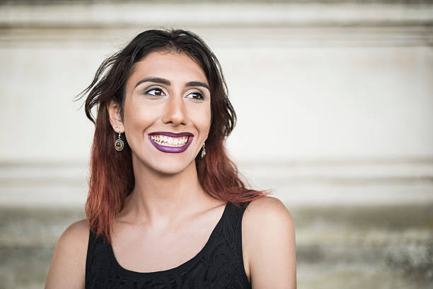Portrait of transgender female looking away, smiling