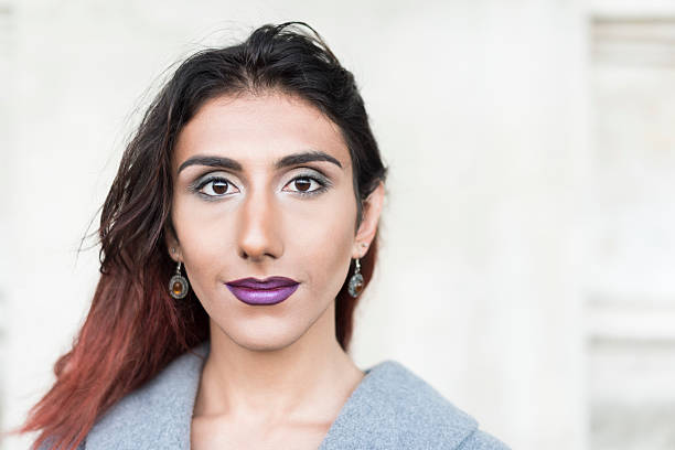 Portrait of transgender female with brown hair and lipstick Attractive Middle Eastern transgender female transgender person photos stock pictures, royalty-free photos & images