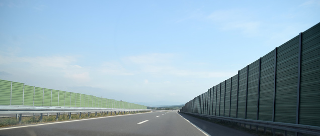 Green noise barrier on the both sides of the highway