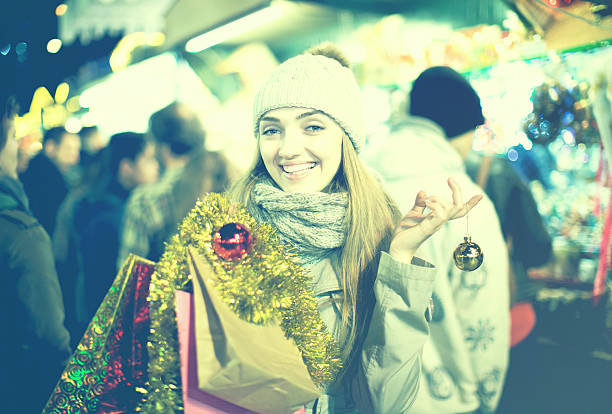 istock Girl at Xmas market 610447816