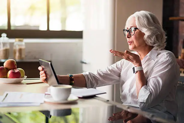 Photo of Granny communicating with her family via skype