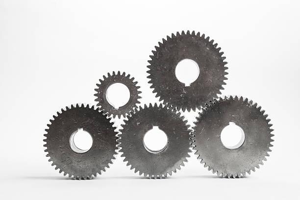 istock set of gears working together on isolated background 610450378