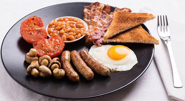 istock full english breakfast on black plate 610450992