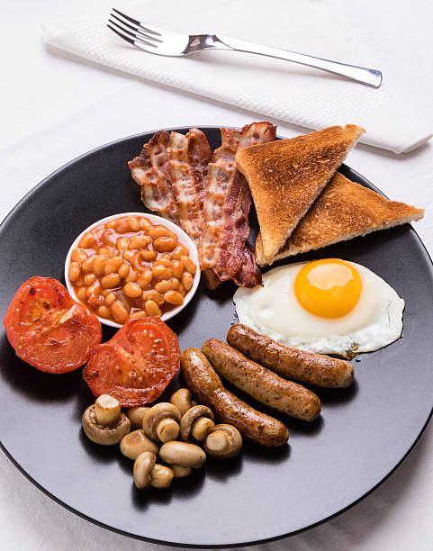 istock full english breakfast on black plate 610451048