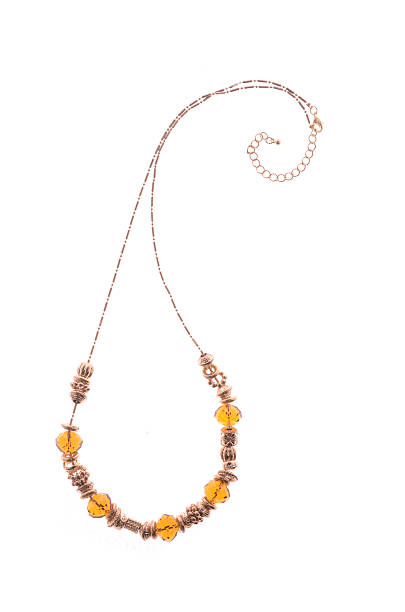 istock necklace with amber beads on white background 610451330