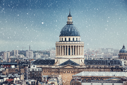 Paris cityscape with Pantheon on a snowy winter day.