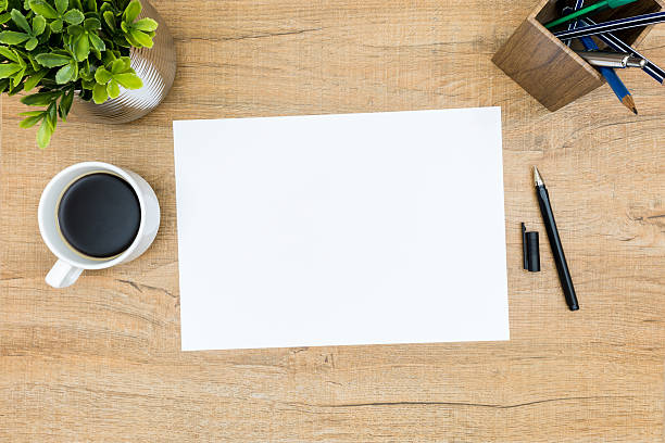 istock Blank paper on the business desk table. 610452252