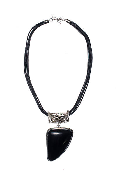 istock necklace with black tusk on a white background 610452666