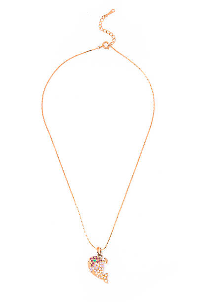 istock gold pendant with whale on a white background 610452882