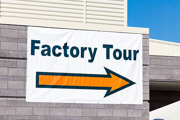 istock Factory Tour Sign with Arrow 610453084