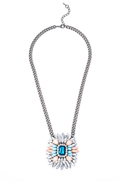 istock pendant with flower and blue gem  on a white background 610453388