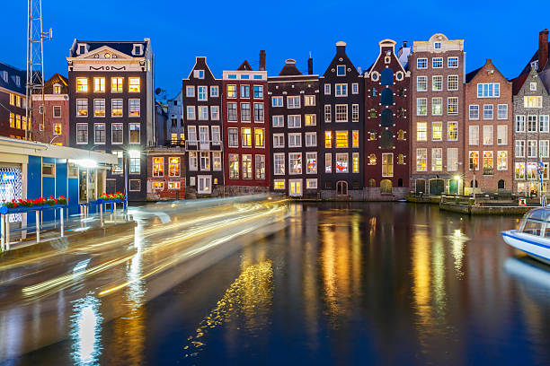 istock Night dancing houses at Amsterdam, Netherlands. 610454636