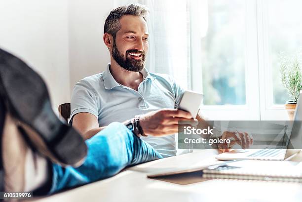 Lucky Bearded Man Makes Business In The Web At Home Stock Photo - Download Image Now