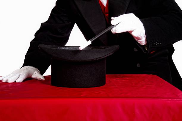 istock Magician with top hat and wand 610540250