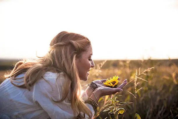 Photo of Beautiful womanl with sunflower outdoors