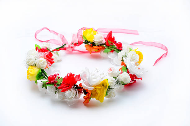 istock wreath with colored flowers isolated on white 610542112