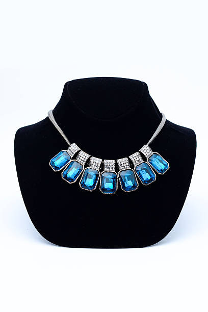 istock necklace with blue stones on mannequin isolated on white 610543590