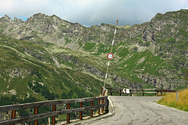 opened barrier at meandering mountain road