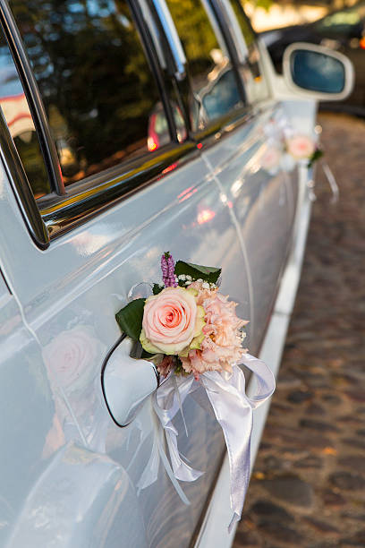 istock Vintage Wedding Car Decorated with Flowers 610543926