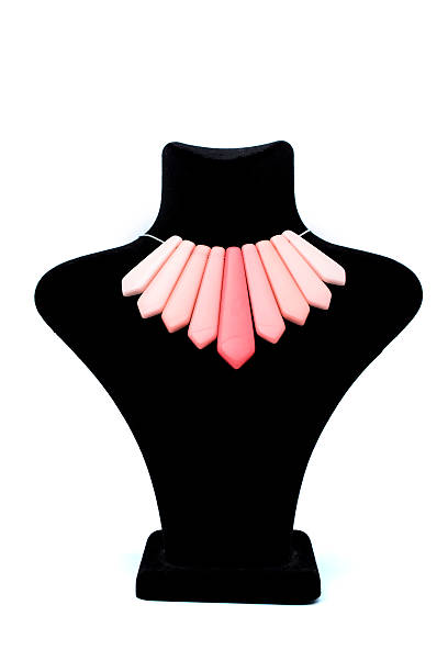 istock Pendant with pink stones on mannequin isolated on white 610544302