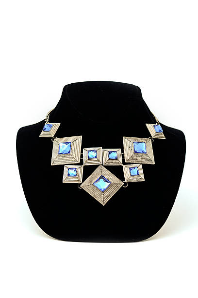 istock Geometric necklace set with precious stones on a mannequin 610544596