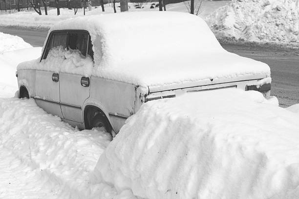 istock Old car in winter in snow on road 610545602