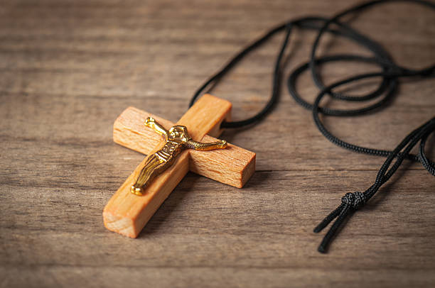 istock holly wooden Christian cross 610545628