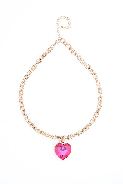 istock Pendant with pink heart  isolated on white 610546892