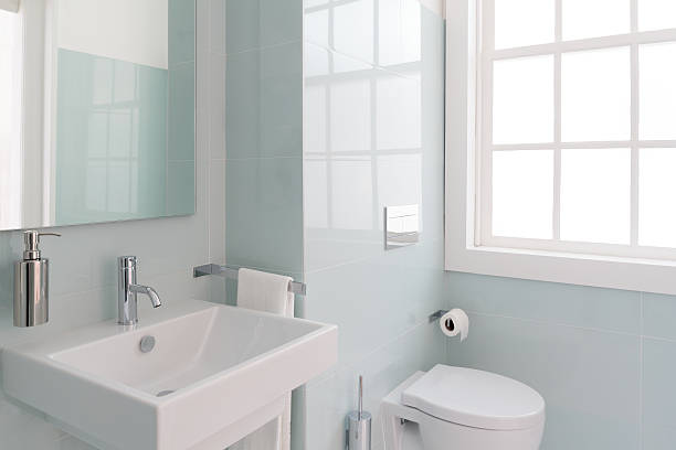 Bright Bathroom Clean and fresh bathroom with natural light public restroom photos stock pictures, royalty-free photos & images