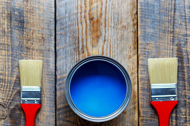 istock painting with can blue paint on wooden background 610547028