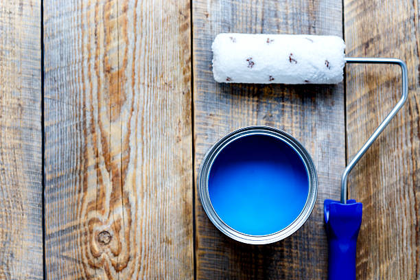 istock painting with can blue paint on wooden background 610548090
