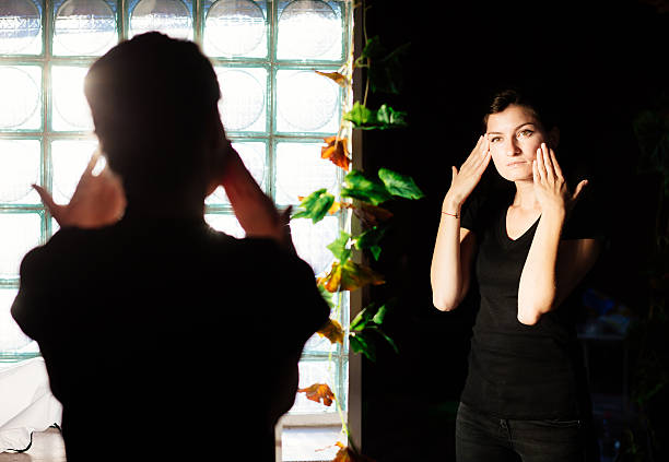 istock Female looking in the mirror 610549326