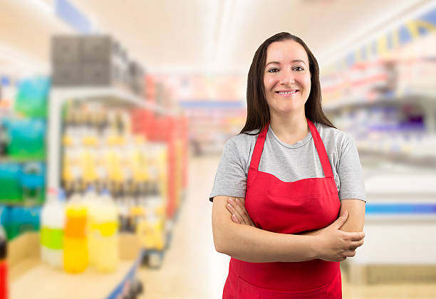 saleswoman at the supermarket - supermarket sales clerk grocer apron imagens e fotografias de stock