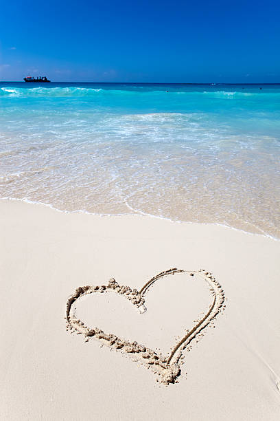 istock heart- a picture on sand 610550360