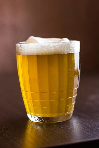 istock Mug of beer on wooden background 610550902