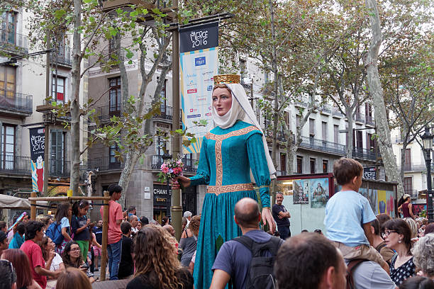 Barcelona, Spain - September 24, 2016: La Merce annual festival Giants Parade. Each year during the feast oversized figures guided by humans parade spinning around the main streets of Barcelona.