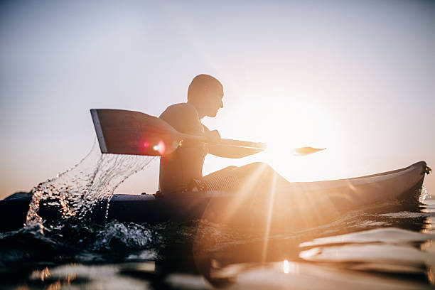 silhouette of a canoeist - oar imagens e fotografias de stock